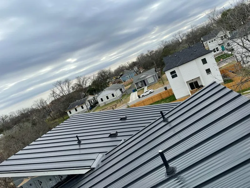 Standing seam metal roof panels with vents for Skylight Repair in Urbana